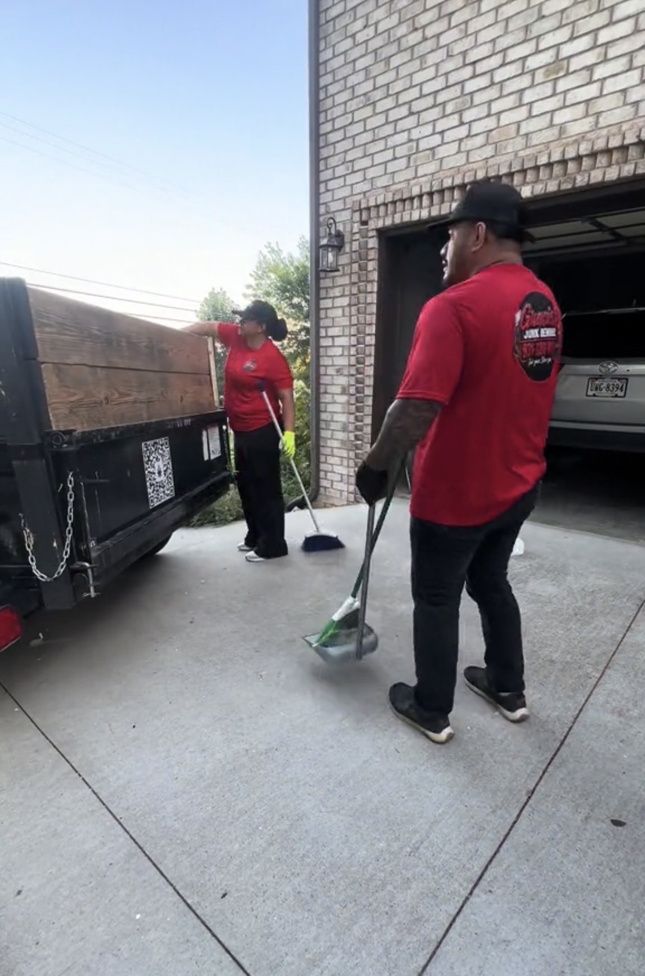 Gracie’s crew sweeping an apartment walkway after pickup
