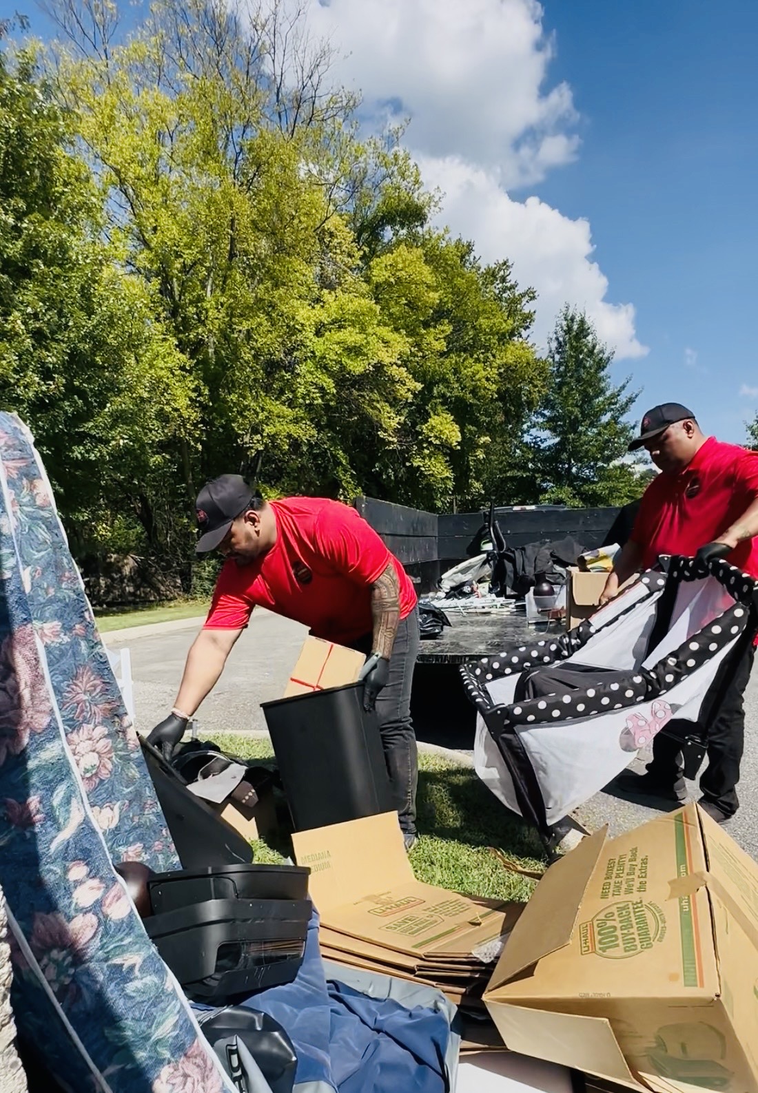 Gracie’s crew loading cardboard and packaging for removal