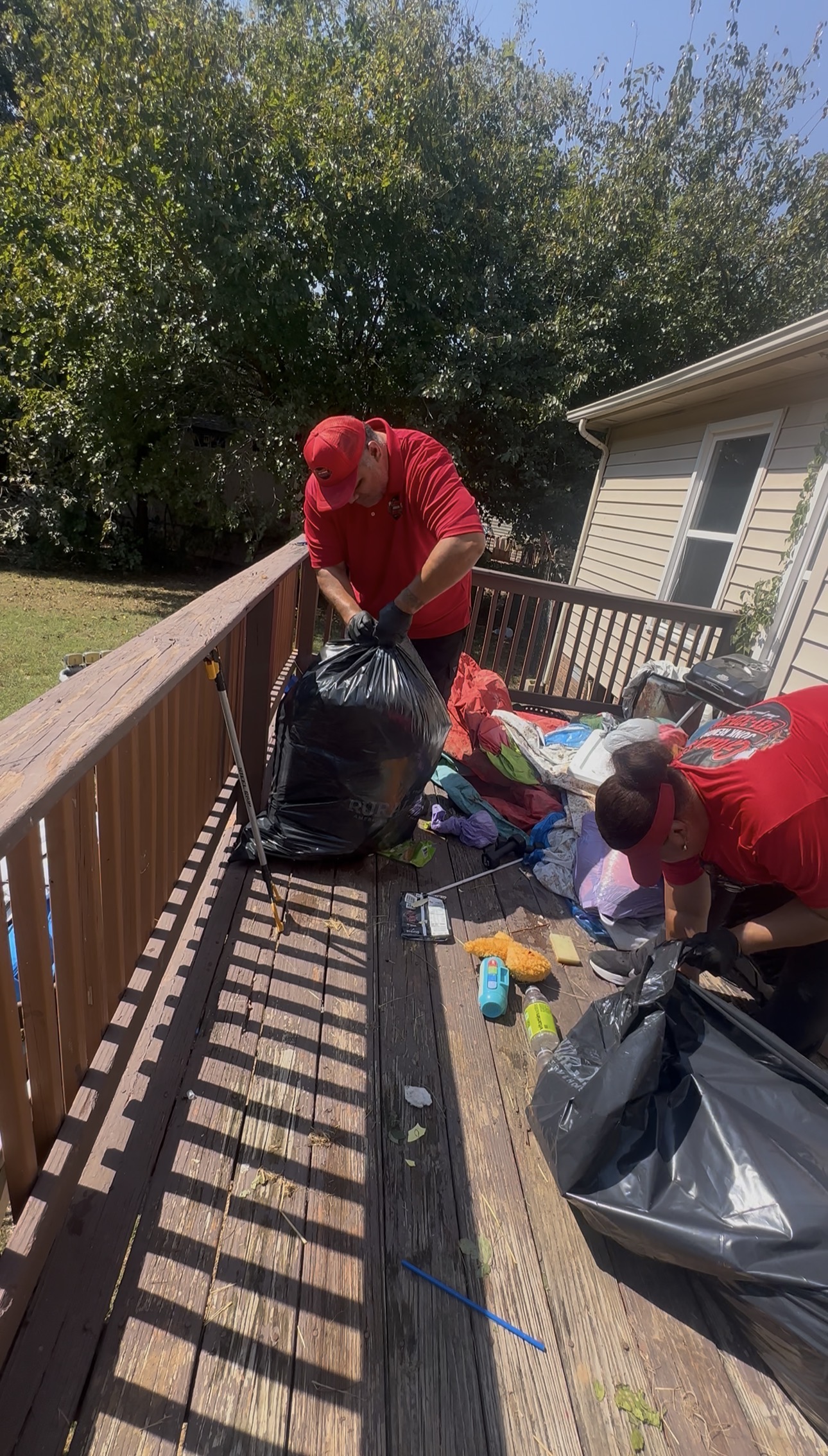 Gracie’s crew bagging household items during a deck cleanout