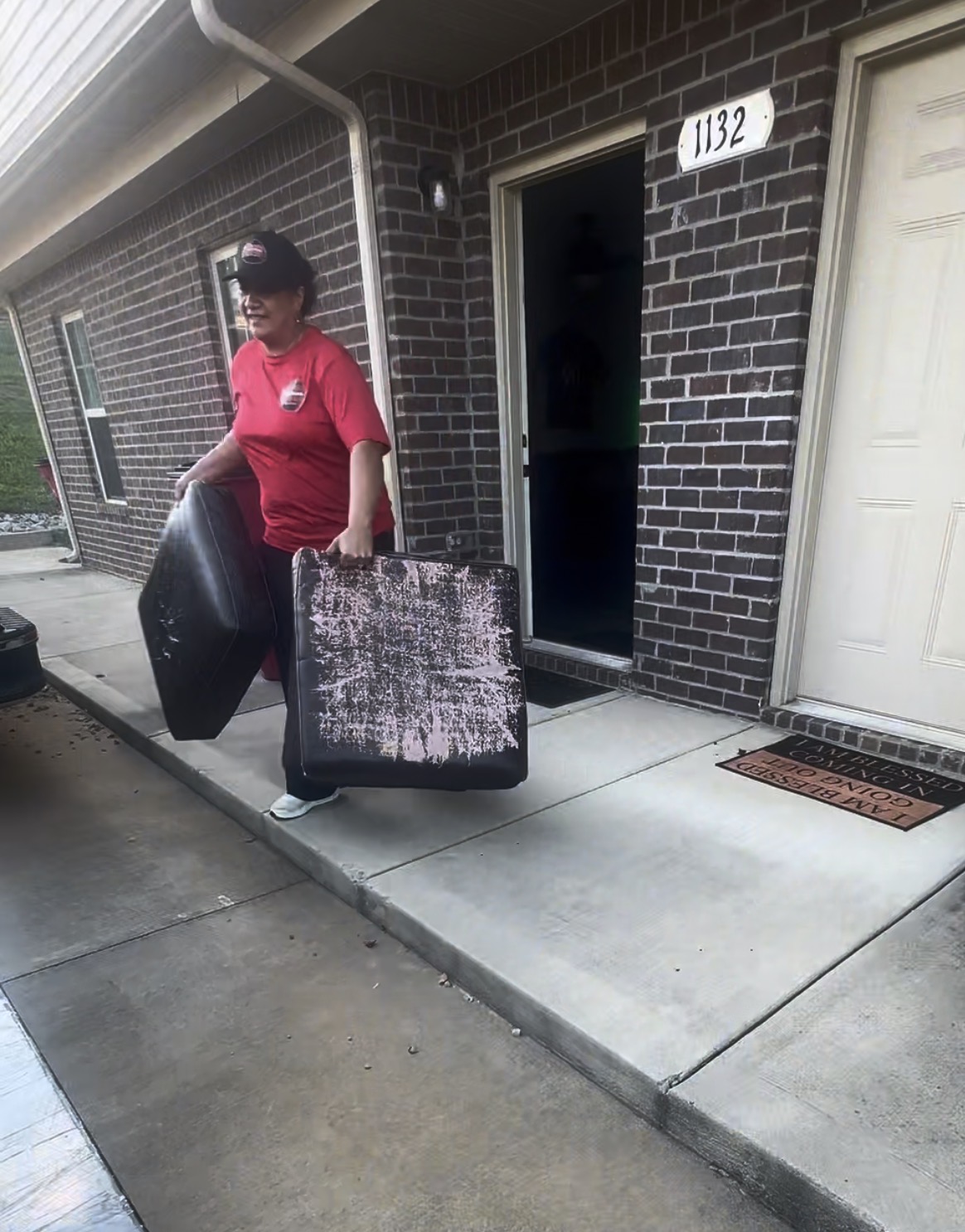 Gracie’s team member carrying furniture from an apartment