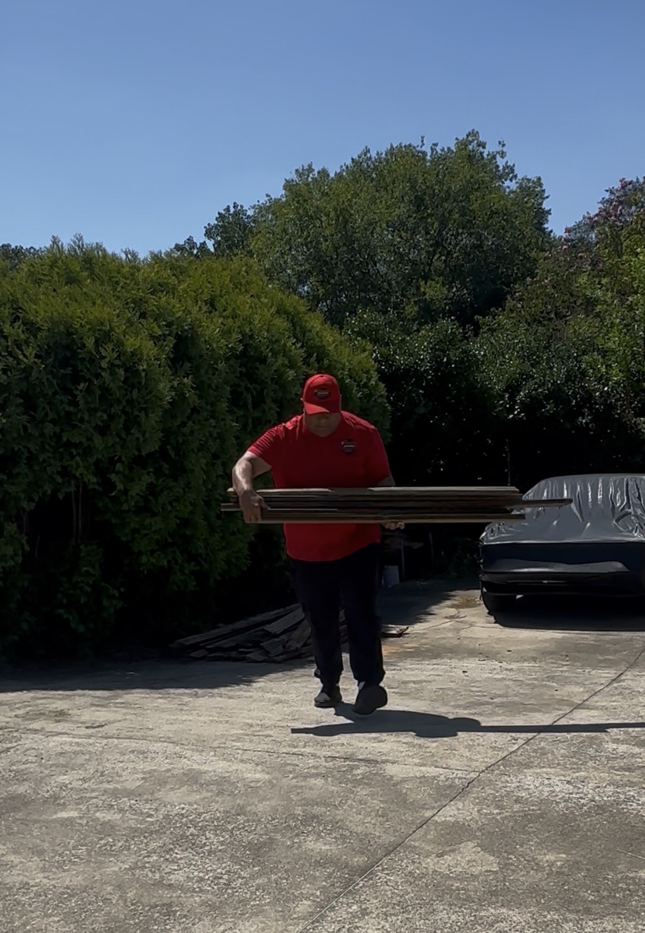 Gracie’s team member moving a table to the truck