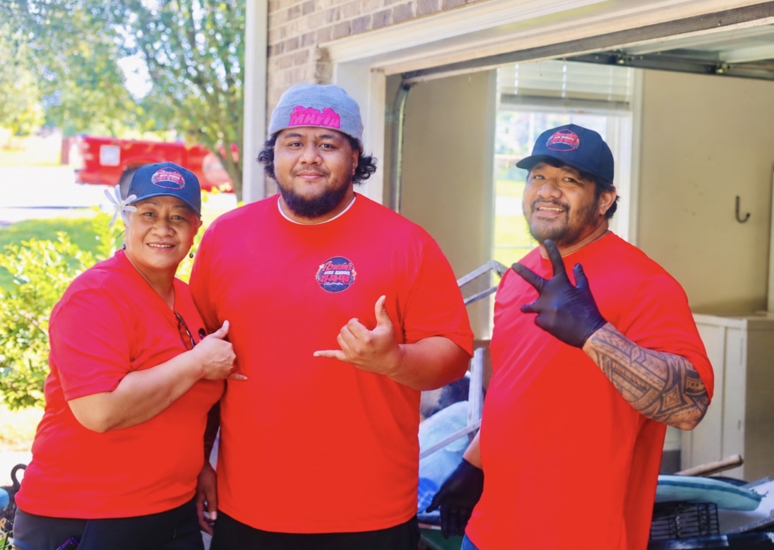 Gracie’s Junk Removal team standing together at a local job